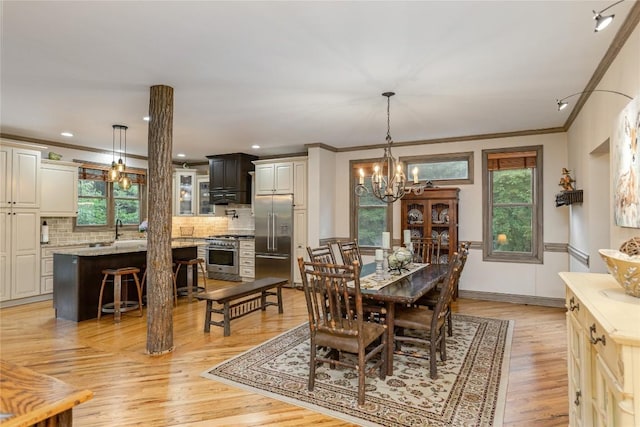 614 Fairway Dr, Lake Toxaway, NC 28747 - dining space with ornamental molding, a chandelier, plenty of natural light, light wood finished floors, and recessed lighting