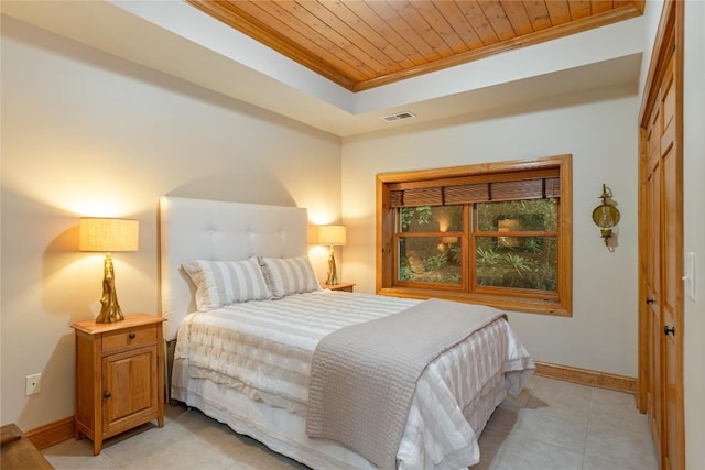 614 Fairway Dr, Lake Toxaway, NC 28747 - bedroom with wood ceiling, crown molding, a raised ceiling, light tile patterned flooring, and a closet