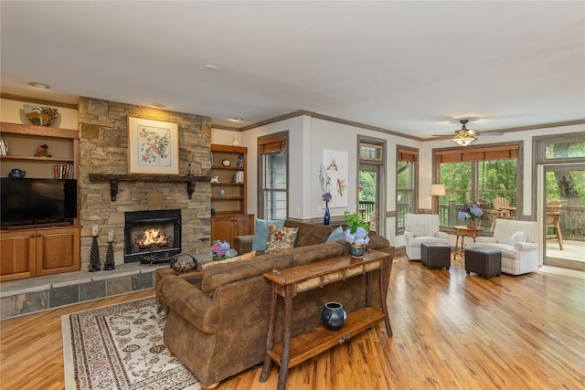 614 Fairway Dr, Lake Toxaway, NC 28747 - living area featuring ornamental molding, wood finished floors, a fireplace, and a ceiling fan