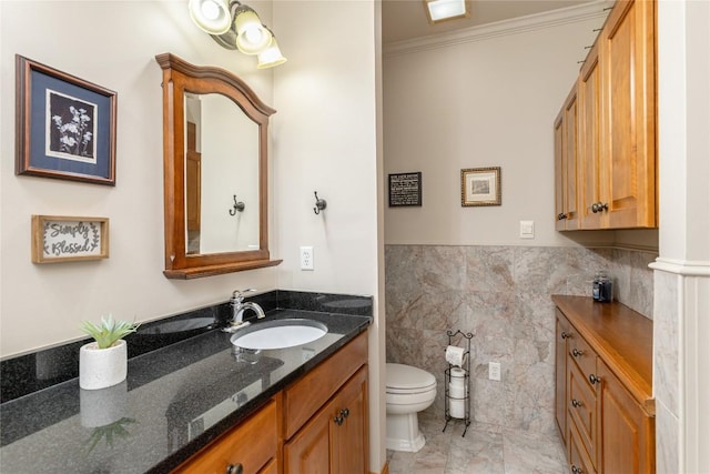 614 Fairway Dr, Lake Toxaway, NC 28747 - bathroom featuring vanity, crown molding, tile walls, and wainscoting