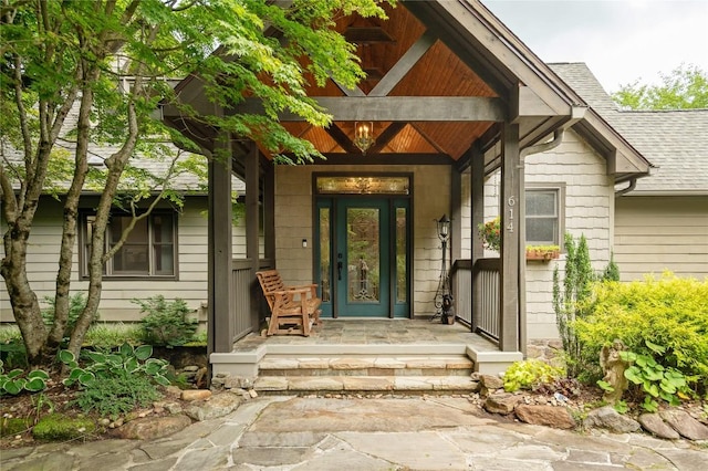 614 Fairway Dr, Lake Toxaway, NC 28747 - property entrance featuring covered porch and a shingled roof