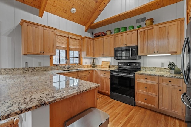 56 First Tee Trl B/Upper, B/Upper Cashiers, NC 28717 - kitchen with stainless steel microwave, black range with electric cooktop, a sink, vaulted ceiling, and light wood finished floors