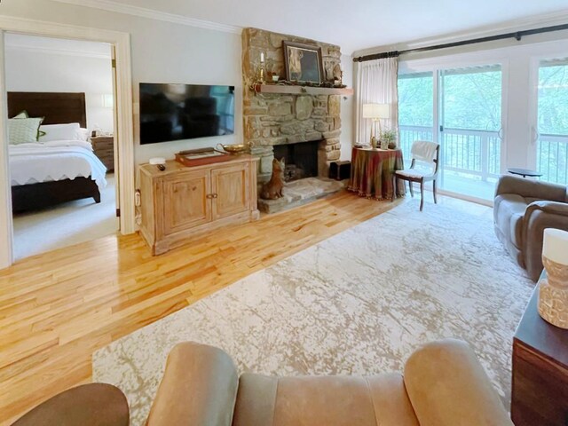 704 Highlands Mountain Club Rd Unit 704, Highlands, NC 28741 - living room featuring wood finished floors, ornamental molding, and a stone fireplace