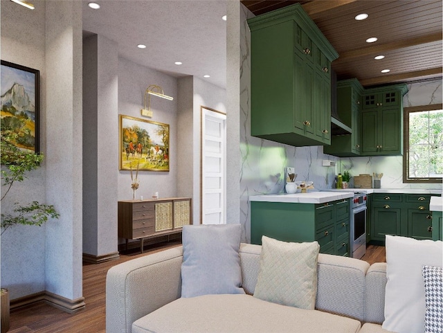 25 Hemlock Rdg, Highlands, NC 28741 - kitchen with green cabinetry, wood finished floors, high end range, light countertops, and recessed lighting