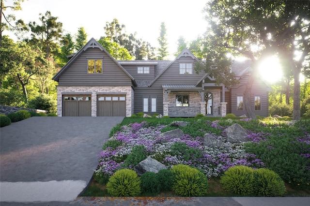 25 Hemlock Rdg, Highlands, NC 28741 - view of front of house featuring stone siding, a garage, and driveway