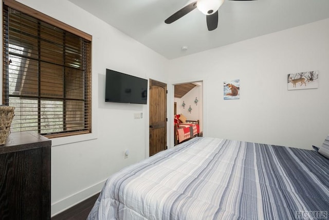 bedroom featuring dark hardwood / wood-style floors and ceiling fan