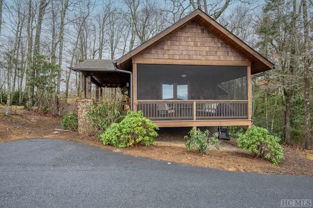 view of front of house featuring a sunroom