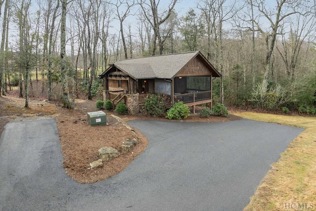 view of front of house featuring a sunroom