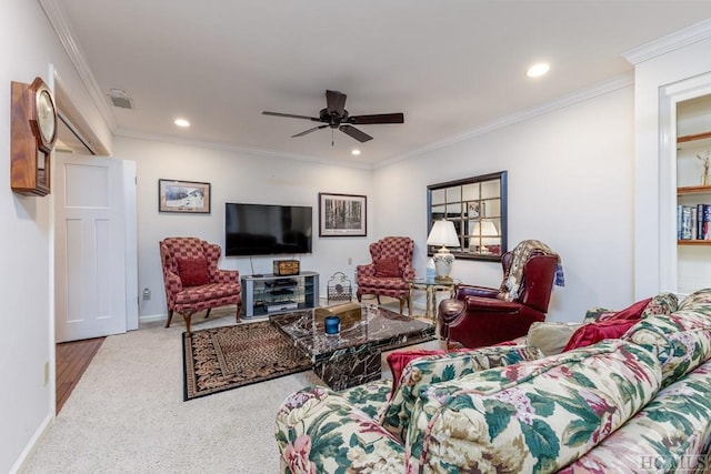 living room featuring crown molding, ceiling fan, and carpet flooring