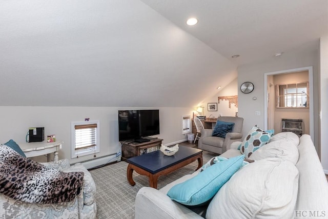 living room featuring vaulted ceiling, a wall mounted AC, and baseboard heating