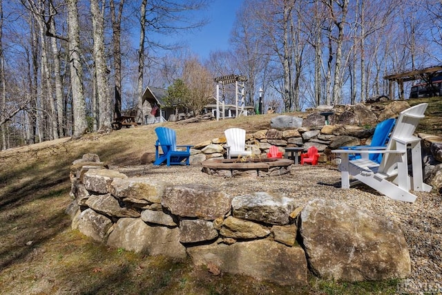 view of yard with an outdoor fire pit