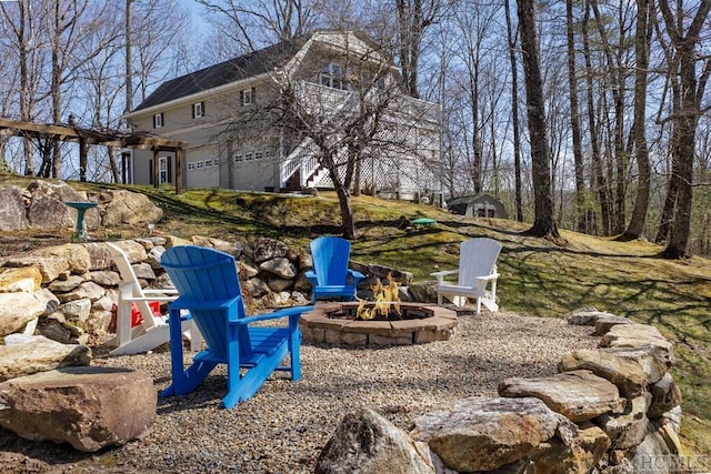 view of yard with an outdoor fire pit