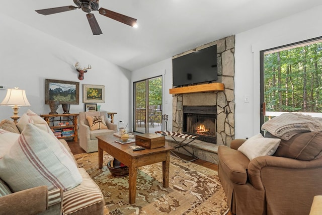 86 Beech Ct, Sapphire, NC 28774 - living room featuring wood finished floors, a stone fireplace, lofted ceiling, and a ceiling fan