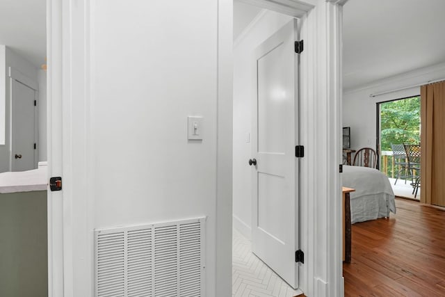 86 Beech Ct, Sapphire, NC 28774 - corridor featuring wood finished floors and crown molding