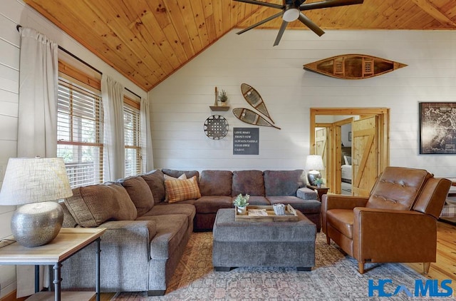 living area featuring lofted ceiling, wooden ceiling, ceiling fan, and wood finished floors