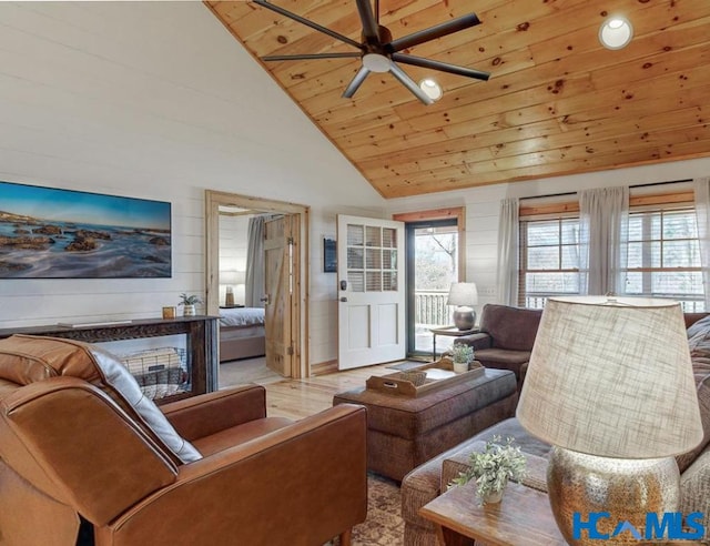 living room with a ceiling fan, wood ceiling, high vaulted ceiling, and wood finished floors