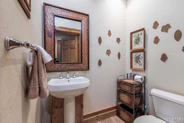 bathroom with sink and toilet