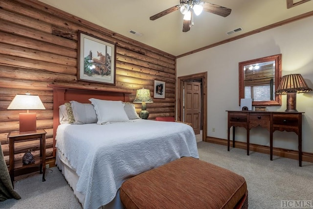 carpeted bedroom featuring crown molding, log walls, and ceiling fan