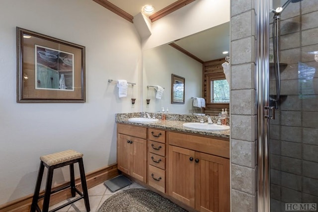 bathroom featuring tile patterned floors, ornamental molding, an enclosed shower, and vanity