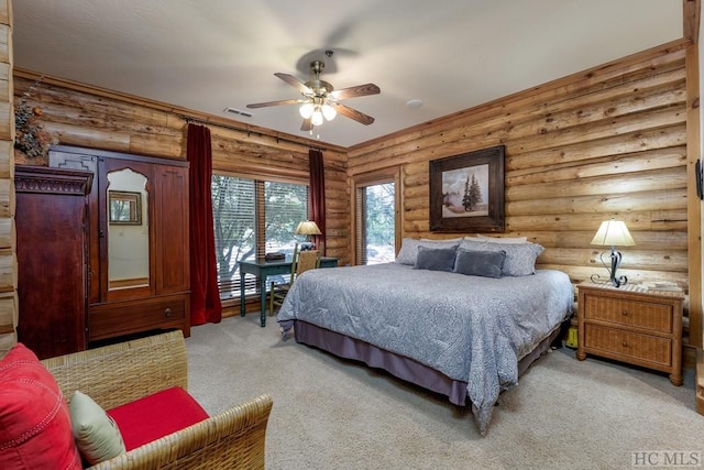 carpeted bedroom featuring log walls and ceiling fan