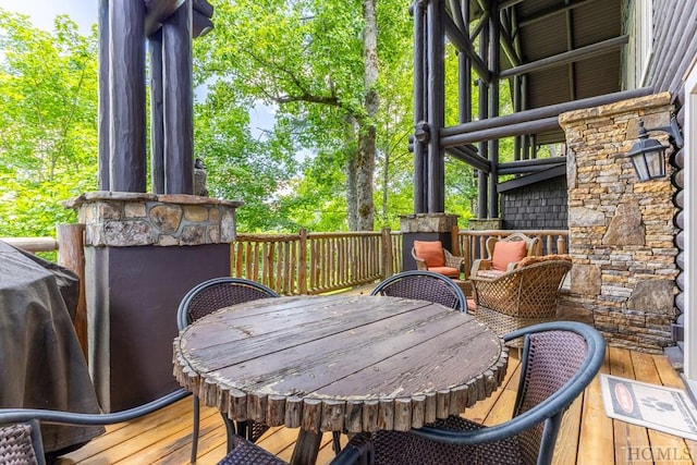 wooden terrace featuring area for grilling