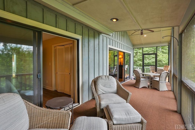 sunroom / solarium with vaulted ceiling and ceiling fan