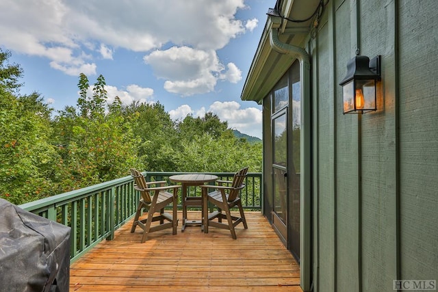 deck featuring a grill