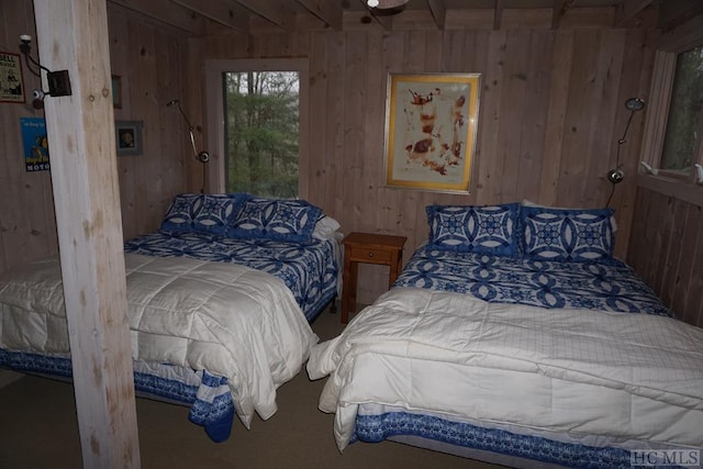 bedroom with wood walls