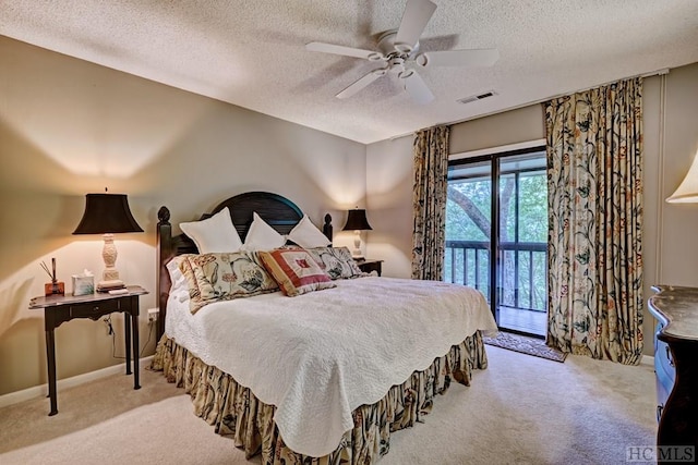 carpeted bedroom with ceiling fan, a textured ceiling, and access to outside