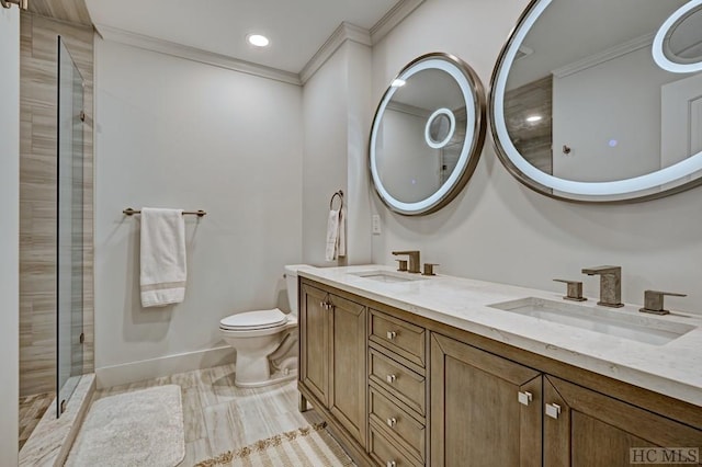 bathroom featuring crown molding, vanity, and toilet