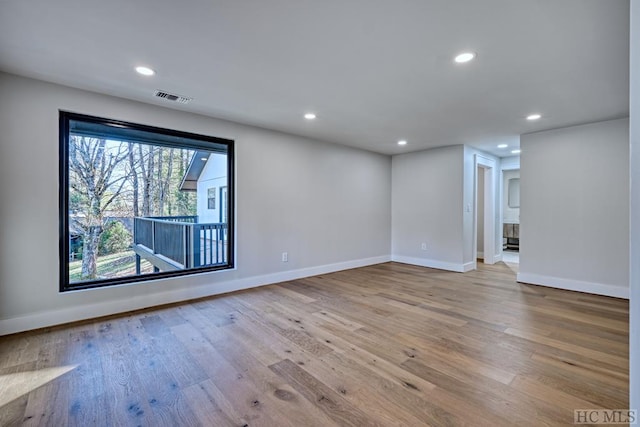 unfurnished room featuring light wood-type flooring