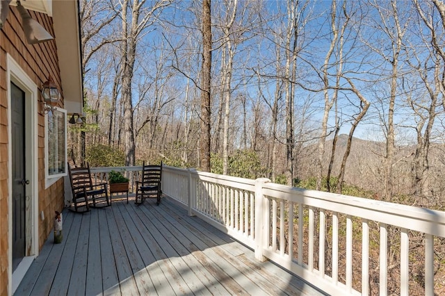 deck featuring a wooded view