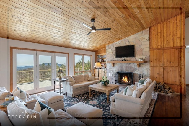 living room with a ceiling fan, wooden ceiling, built in features, and french doors