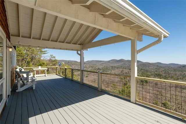 wooden terrace featuring a mountain view