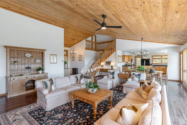 living area with wood ceiling, hardwood / wood-style floors, stairs, and ceiling fan with notable chandelier