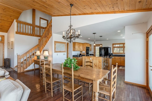 dining room featuring stairway, baseboards, dark wood-style flooring, vaulted ceiling, and wood ceiling