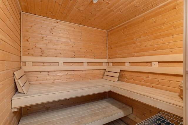 bedroom featuring wooden ceiling and light carpet