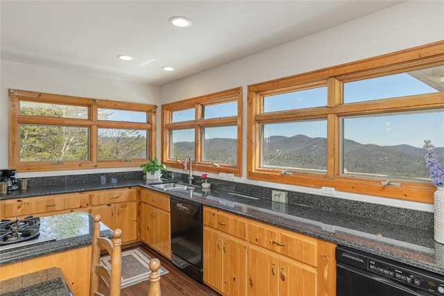 kitchen with dishwasher, recessed lighting, a mountain view, and a sink