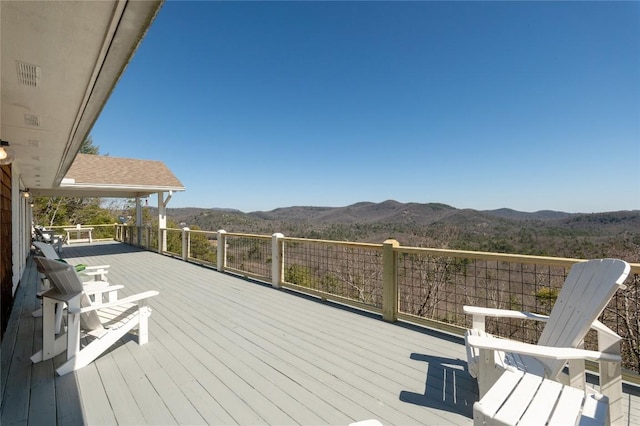 wooden terrace featuring a mountain view