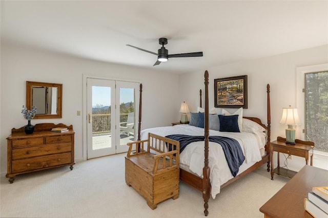 bedroom with access to outside, light colored carpet, and ceiling fan