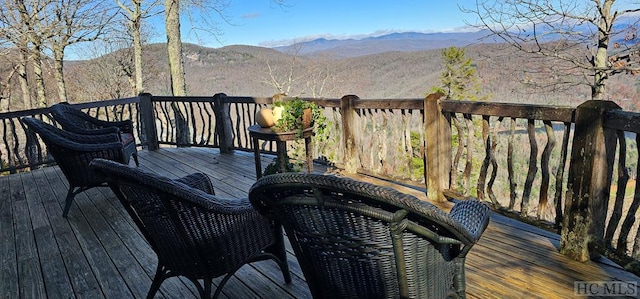 wooden deck featuring a mountain view