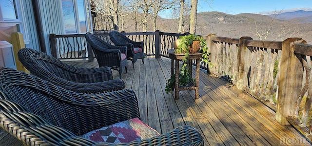 wooden terrace featuring a mountain view