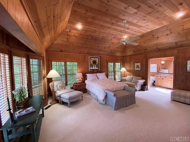 bedroom featuring high vaulted ceiling, wooden walls, light colored carpet, ceiling fan, and wood ceiling