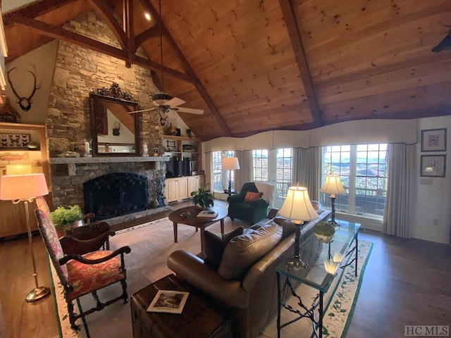 living room featuring a stone fireplace, high vaulted ceiling, wood-type flooring, wooden ceiling, and beam ceiling