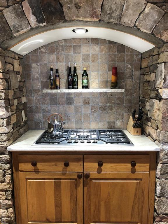 kitchen featuring lofted ceiling and stainless steel gas cooktop