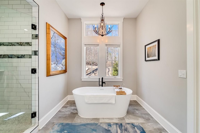 1132 Southshore Dr, Tuckasegee, NC 28783 - bathroom featuring plenty of natural light, a shower stall, baseboards, and a freestanding bath