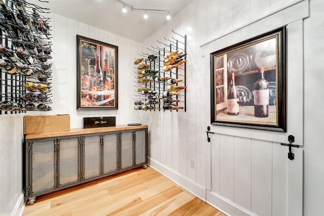 1132 Southshore Dr, Tuckasegee, NC 28783 - wine cellar featuring light wood-type flooring, baseboards, rail lighting, and radiator heating unit
