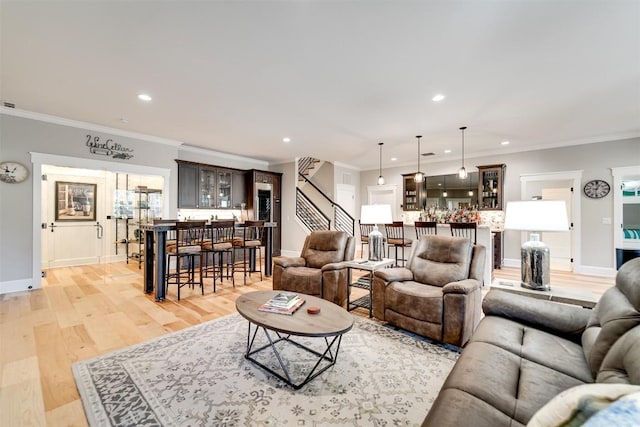 1132 Southshore Dr, Tuckasegee, NC 28783 - living area with stairway, crown molding, light wood finished floors, and a dry bar