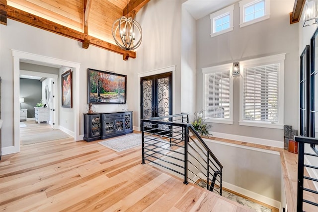 1132 Southshore Dr, Tuckasegee, NC 28783 - entrance foyer featuring baseboards, wood finished floors, a high ceiling, french doors, and a chandelier