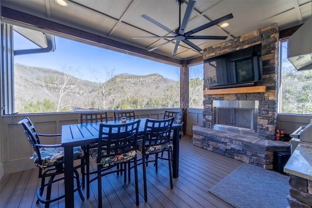 1132 Southshore Dr, Tuckasegee, NC 28783 - wooden deck with a ceiling fan, outdoor dining space, and an outdoor stone fireplace